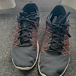 Black Athletic Shoes with Orange Accents